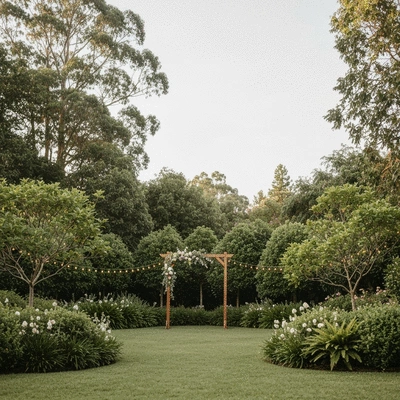 Charming garden wedding venue with lush greenery, fairy lights, and a simple arch, natural light, no text, no words, no typography, 8K